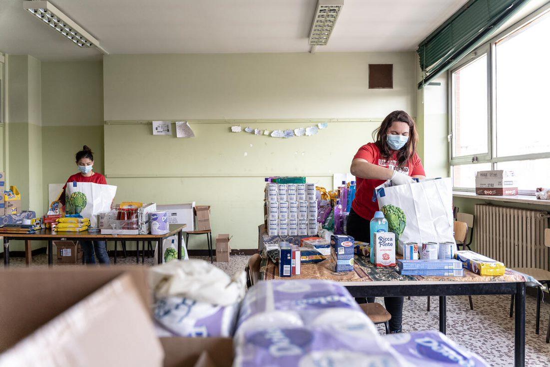 Image of volunteers packing care kits for Save The Children